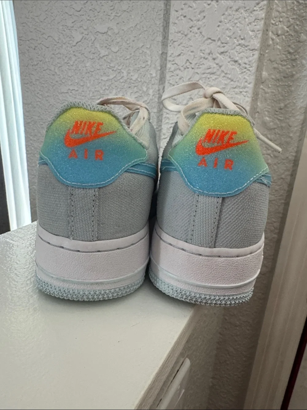 Nike Kids Light Blue Canvas Sneakers with Rainbow Gradient Swoosh